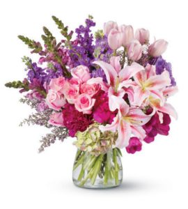 whitel lilies with white tulips and pink and purple flowers