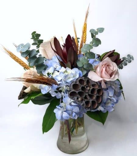 ovely combination of hydrangea, roses, safari sunset, and other fall accents