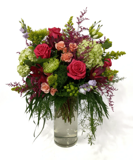 Knock their socks off with this stunning arrangement! This showy arrangement is full of lush hydrangea, roses, lisianthus and more.
